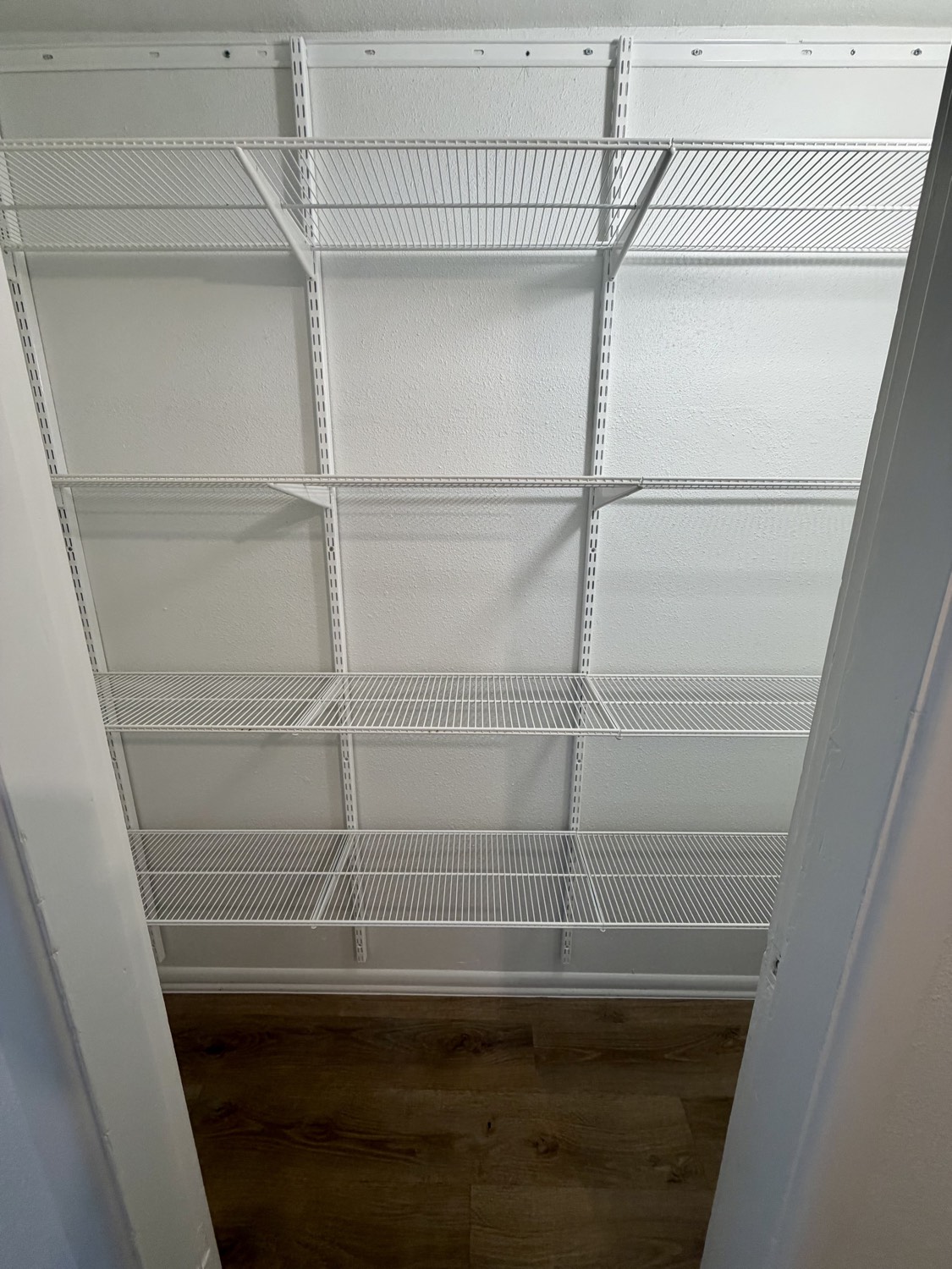 Pantry with new white wire shelving