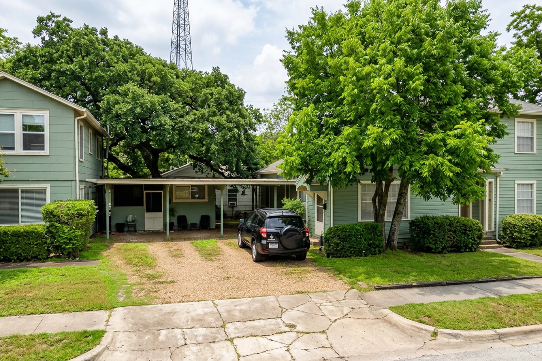 Exterior of 1505 W. 12th Street — green two-story home in Historic Clarksville, Austin