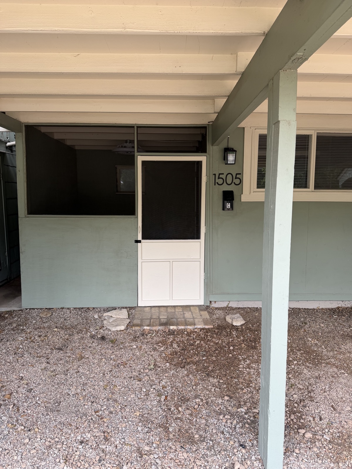 Private front door entry of Unit C at 1505 W. 12th Street with new exterior light fixture